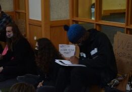 Group sitting on floor, engaged in activity