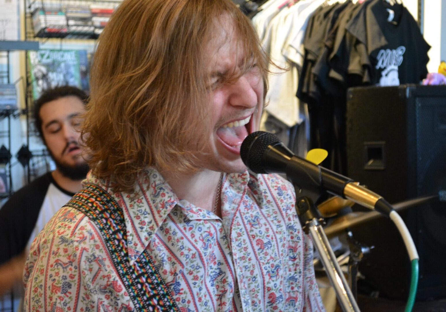 Singer performing passionately with microphone