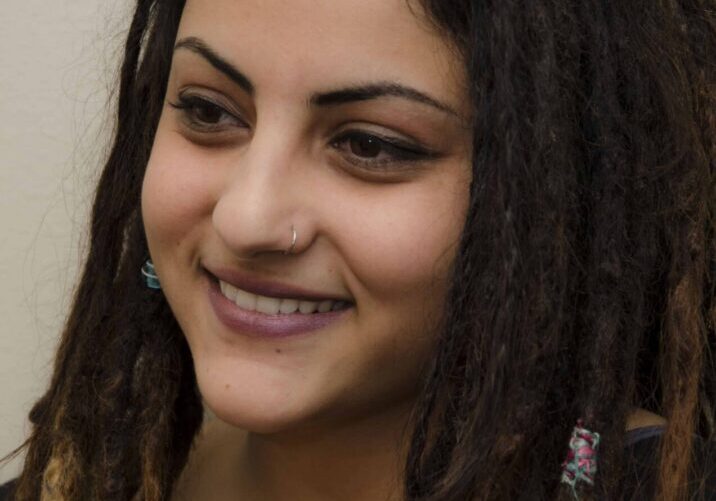 Woman with nose ring and dreadlocks