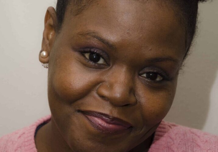 Smiling woman wearing pearl earrings