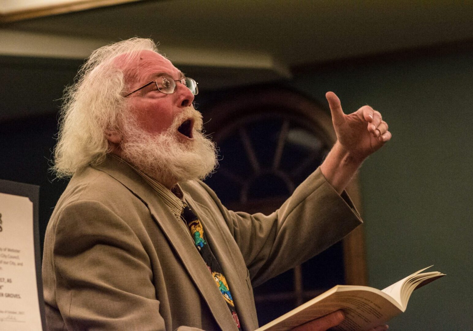 Bearded man giving an animated lecture