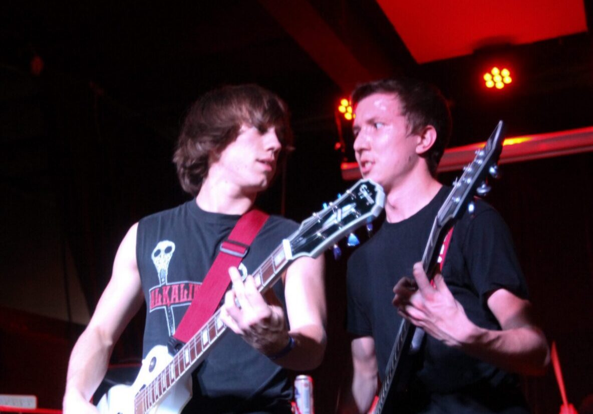 Musicians playing guitars on stage