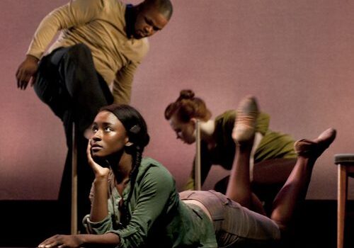 Stage performers in expressive poses