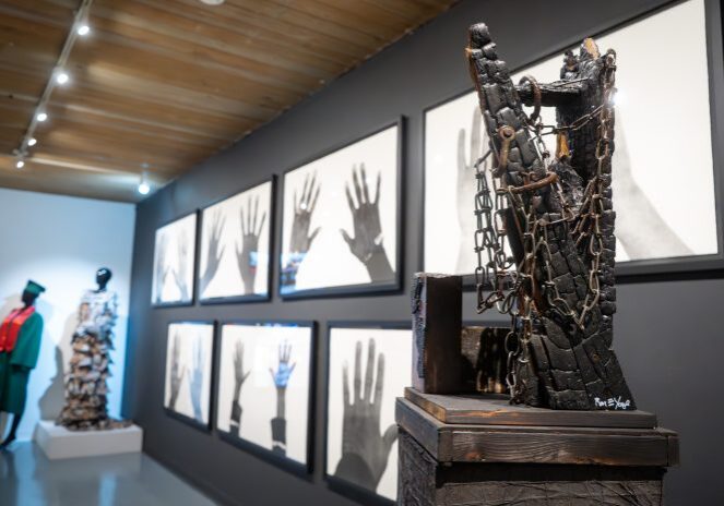 Sculpture with chains in modern gallery