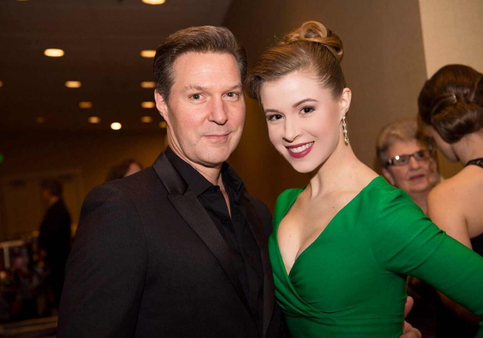 Elegant couple posing at a party
