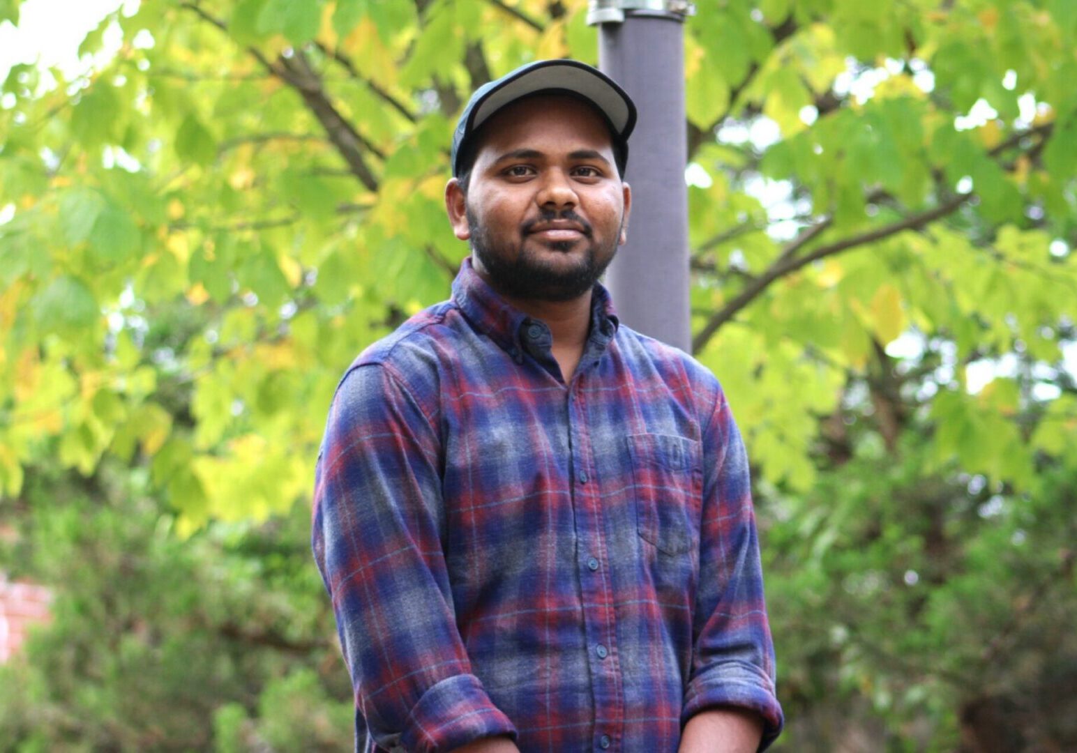 Man in plaid shirt outdoors