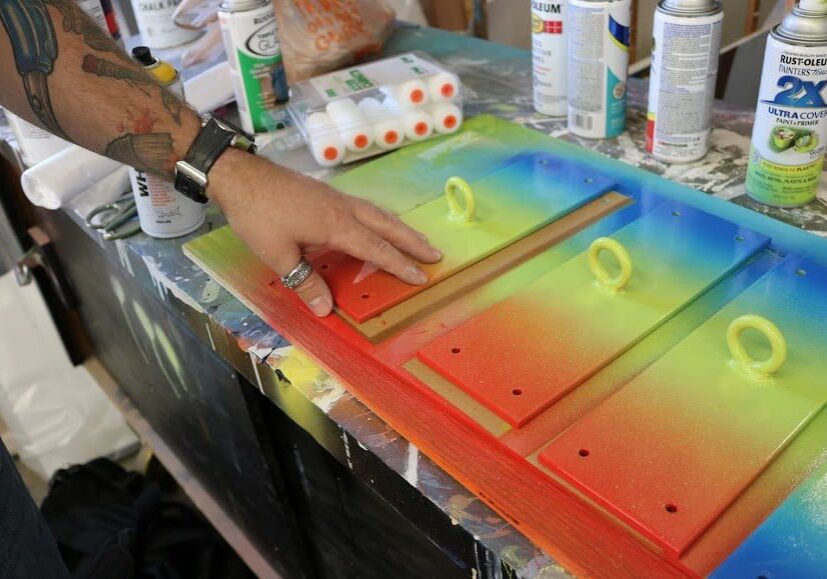Spray-painted boards with vibrant colors