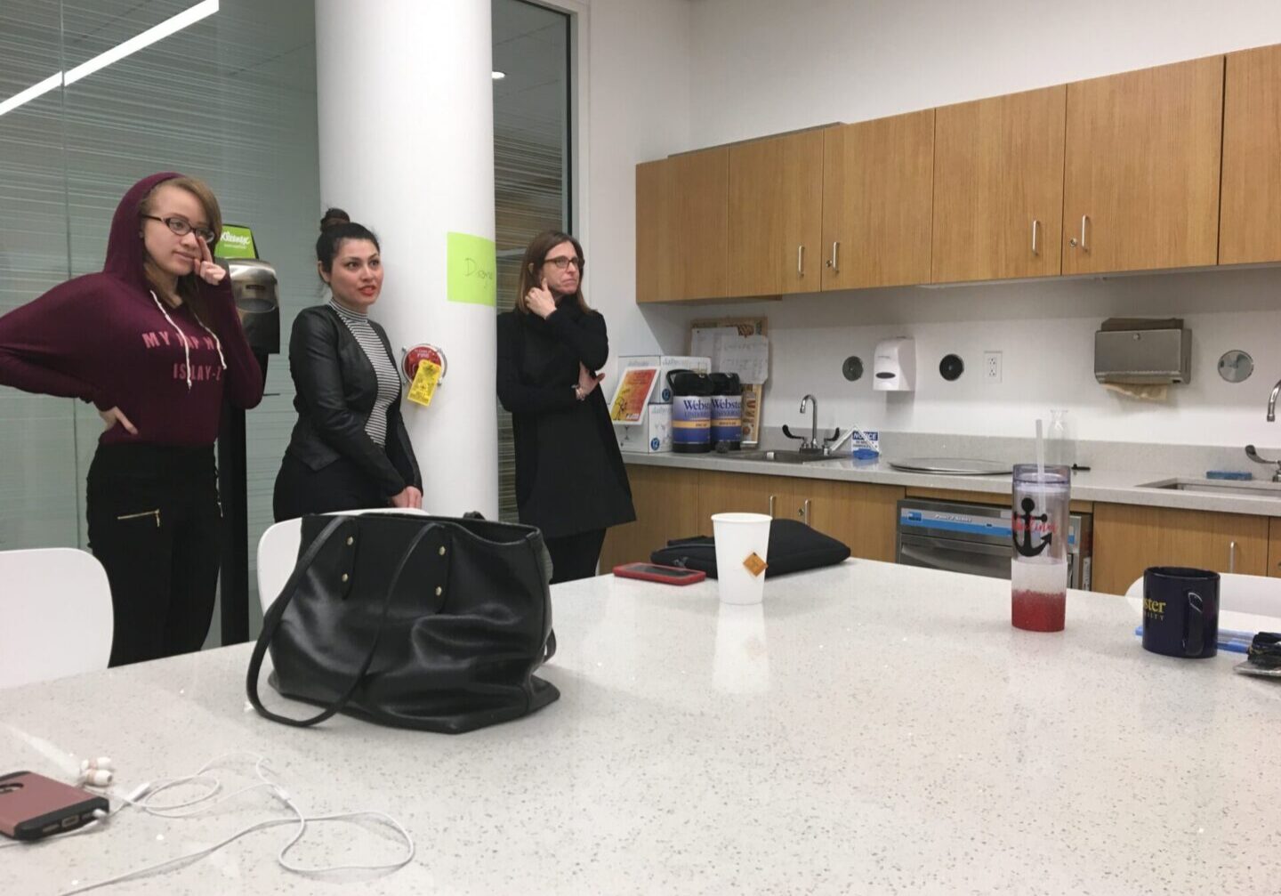 Women gathered in an office kitchen