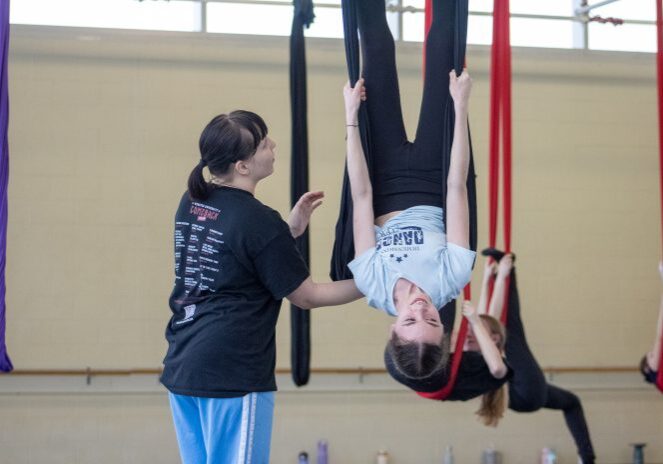 Aerial yoga practice with guidance