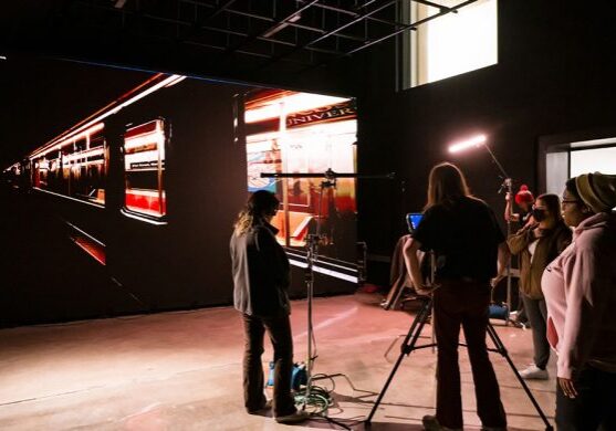 Crew setting up scene in studio