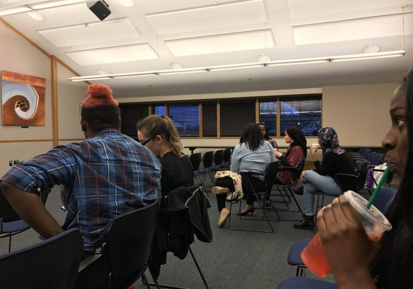 People sitting in a classroom setting