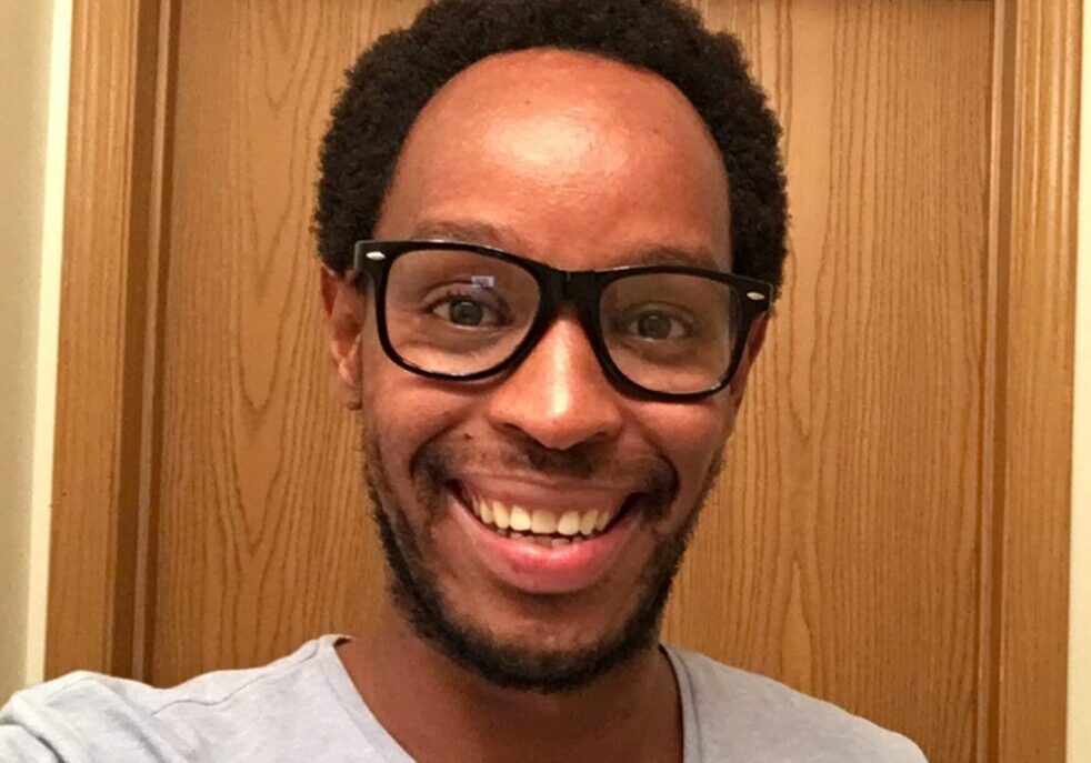 Happy person wearing glasses indoors