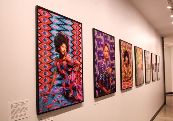 Colorful portraits displayed in a gallery