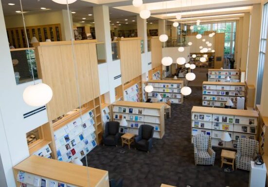 Modern library with bright lighting and books.