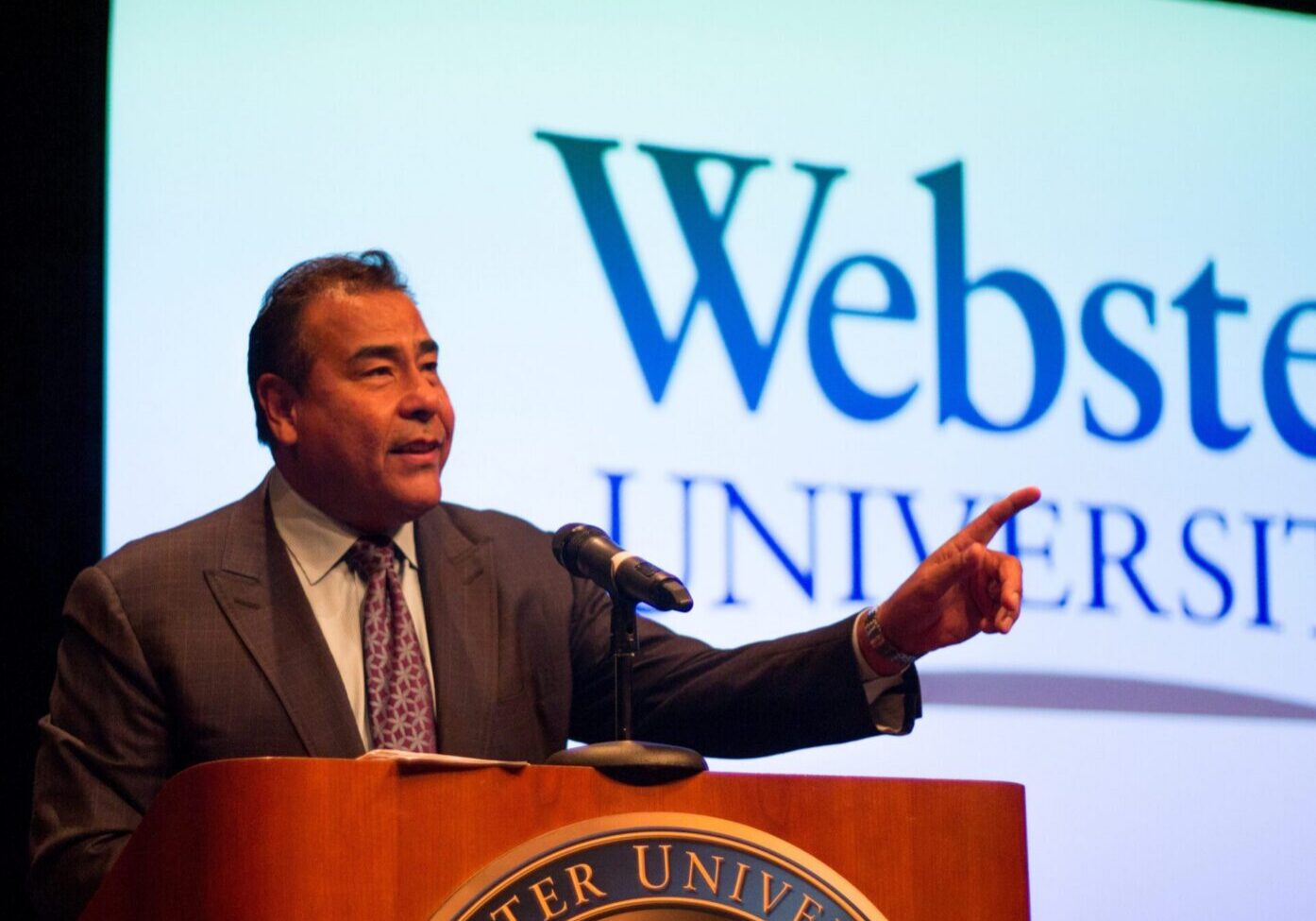 Speaker at Webster University podium