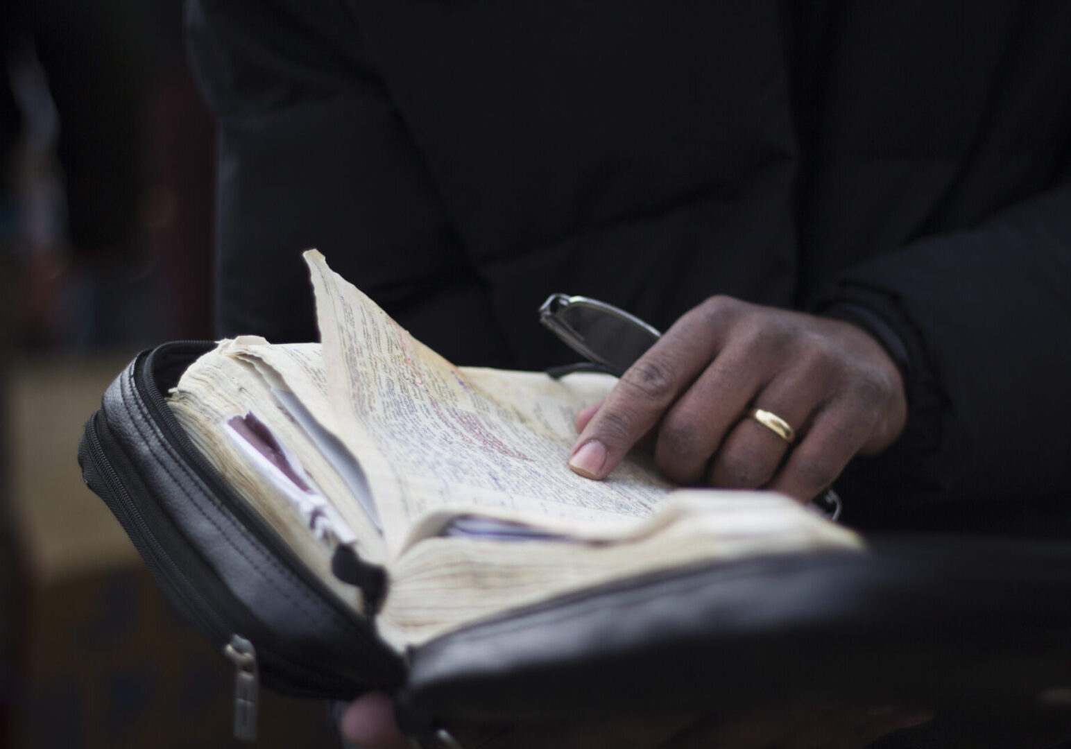 Close-up of book with notes and pen