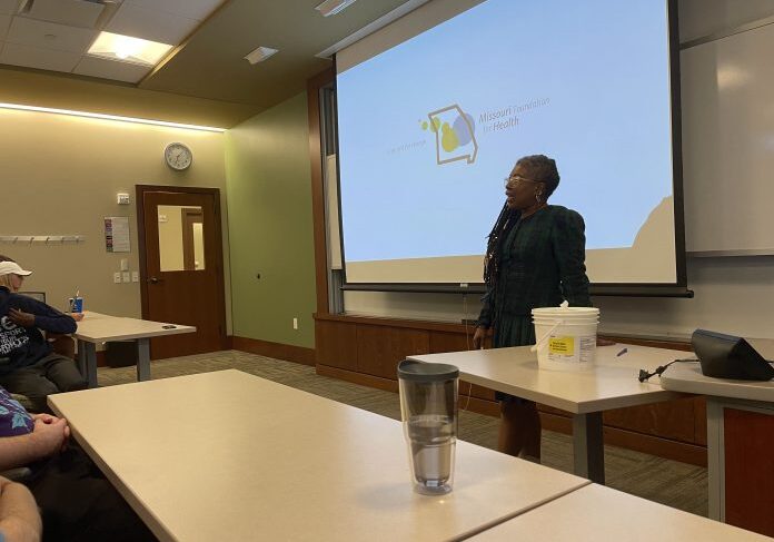 Woman giving a lecture with presentation