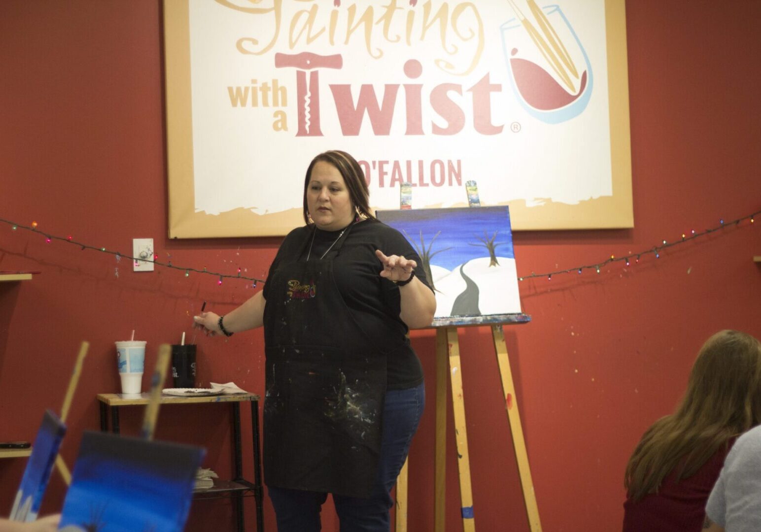 Painting instructor giving a demonstration