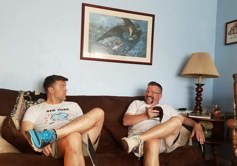 Friends relaxing with drinks at home