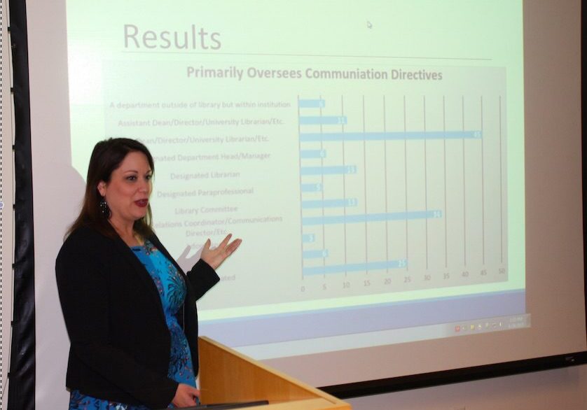 Presentation with bar chart and speaker