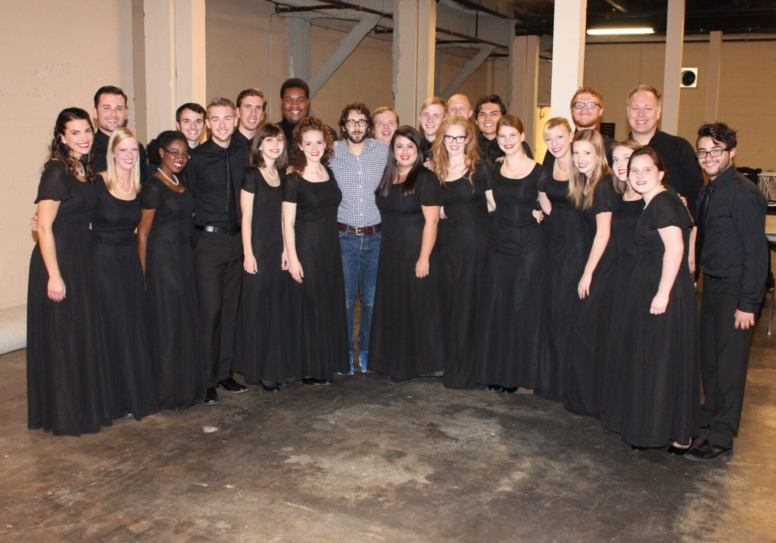 Group of performers in black attire