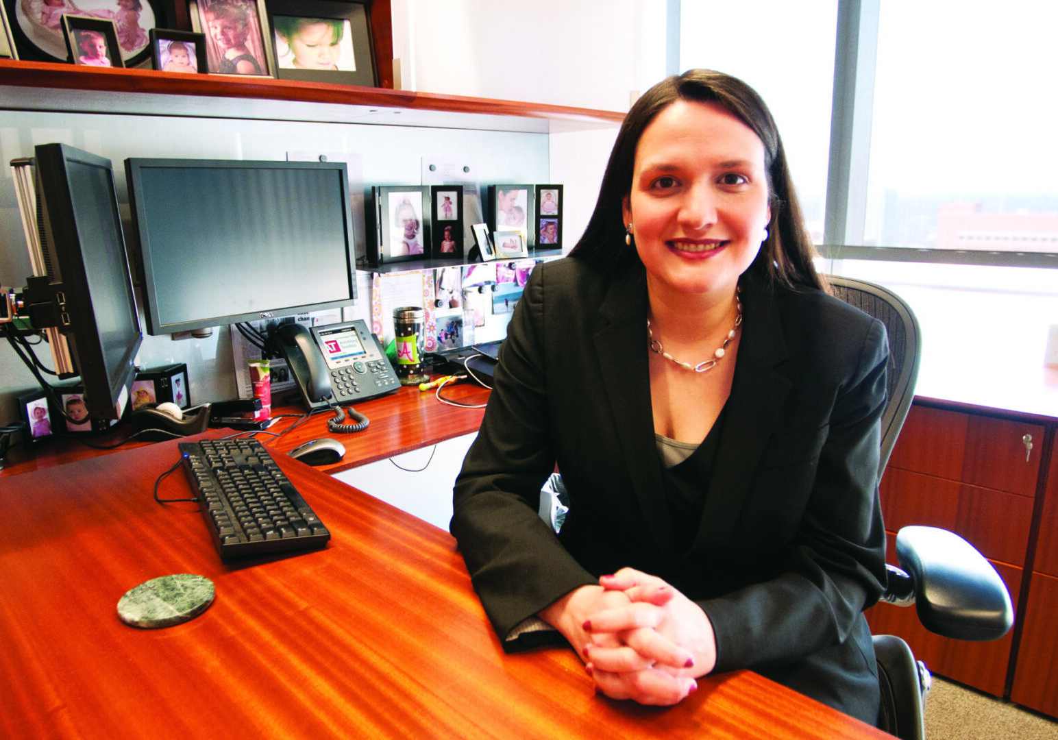 Executive smiling at workplace desk