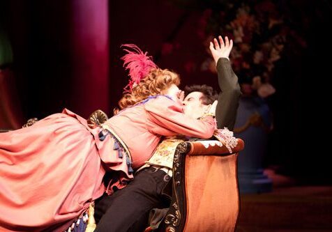 Theatrical scene with dramatic embrace