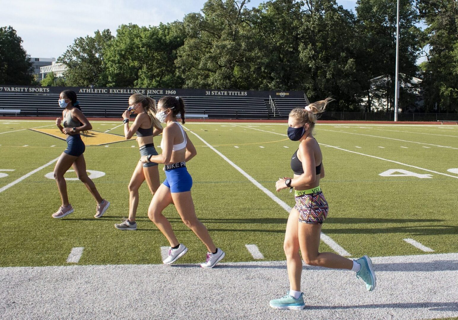 Group jogging on sports field