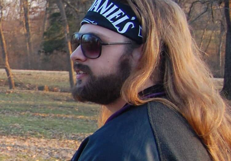Person with flowing hair enjoying a park