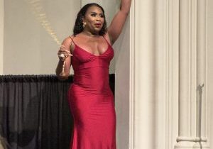 Elegant woman in red gown at event