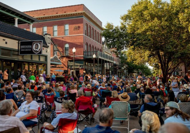 People enjoying outdoor festival downtown