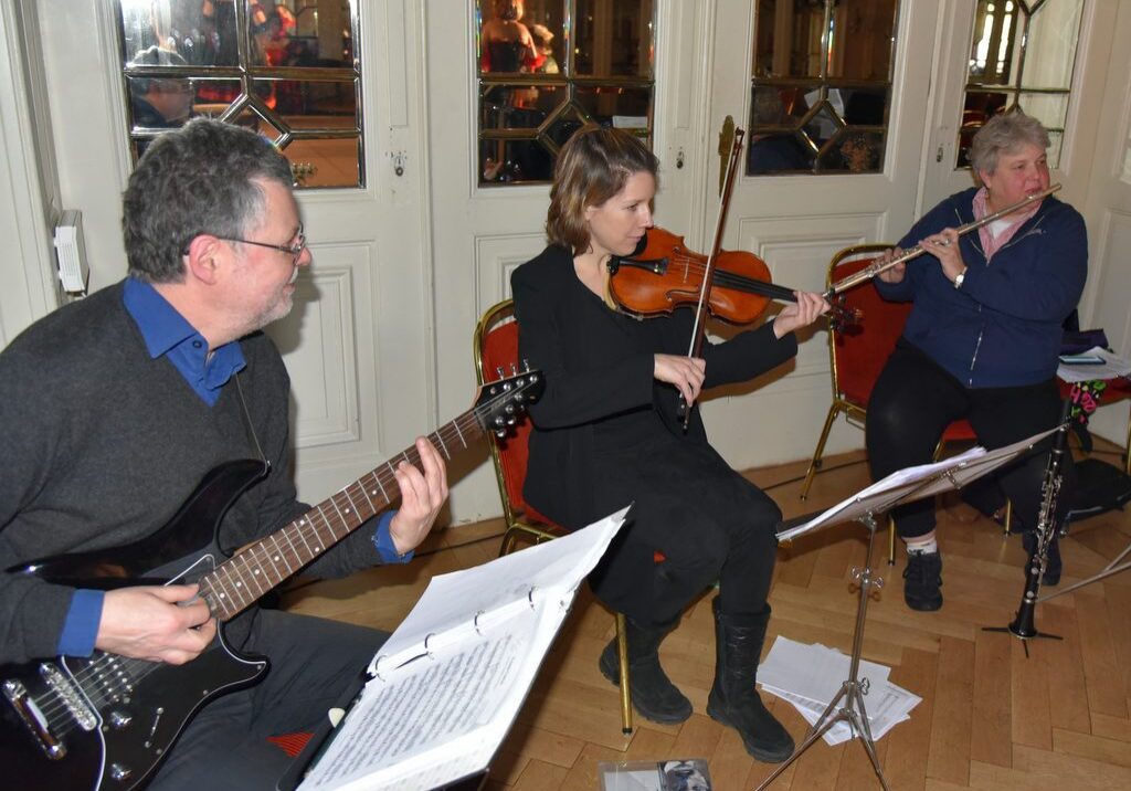 Group of musicians in a rehearsal setting