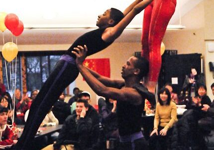 Trio of acrobats showcasing strength and balance.
