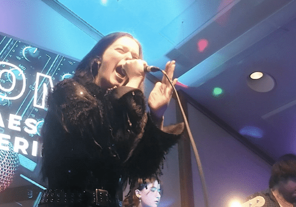 Vocalist holding microphone passionately