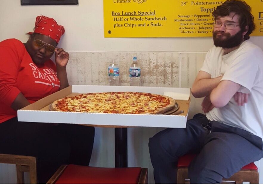 Dining with an oversized pizza box