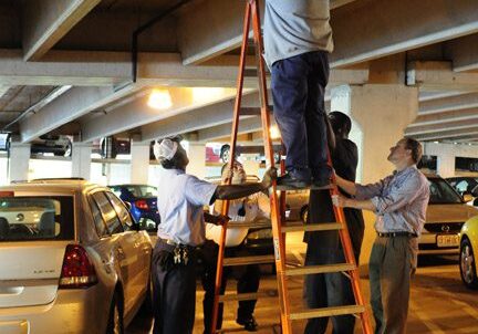Team repairing in underground parking lot