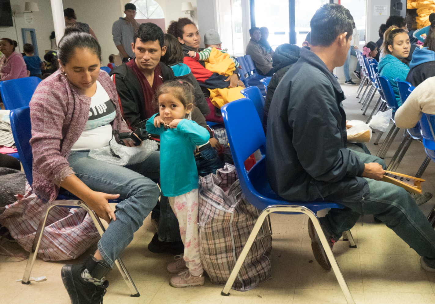 Family seated in community center