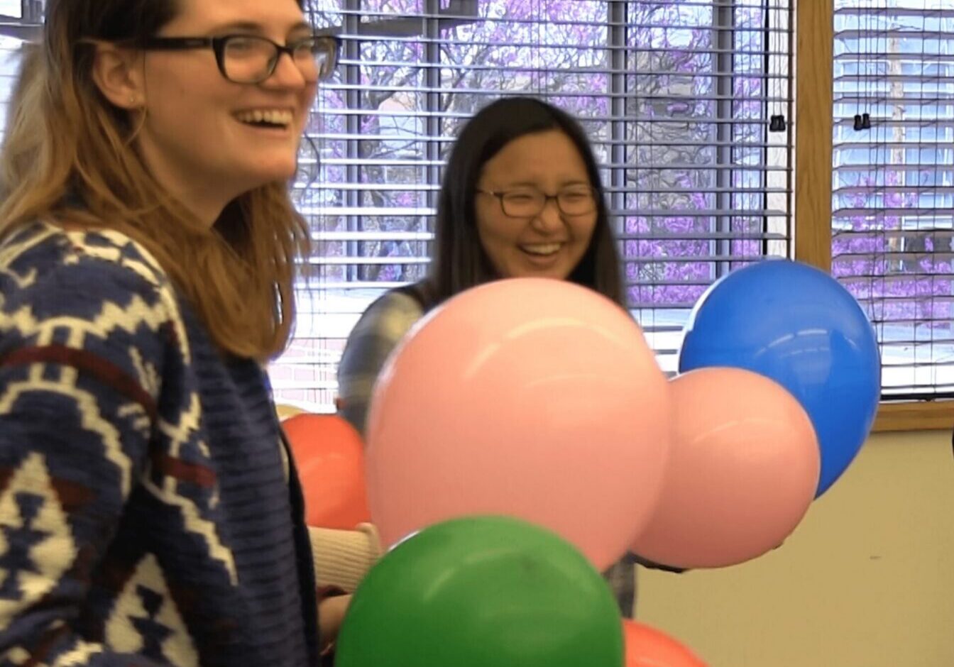 Friends enjoying a balloon-filled celebration