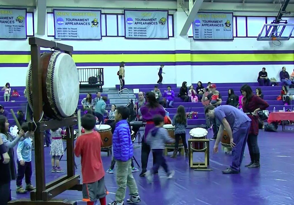 Kids participating in a drumming event
