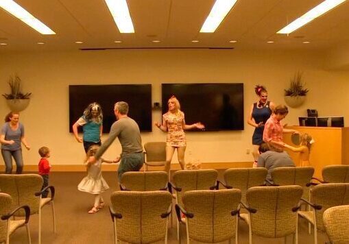 Group enjoying dance in meeting space