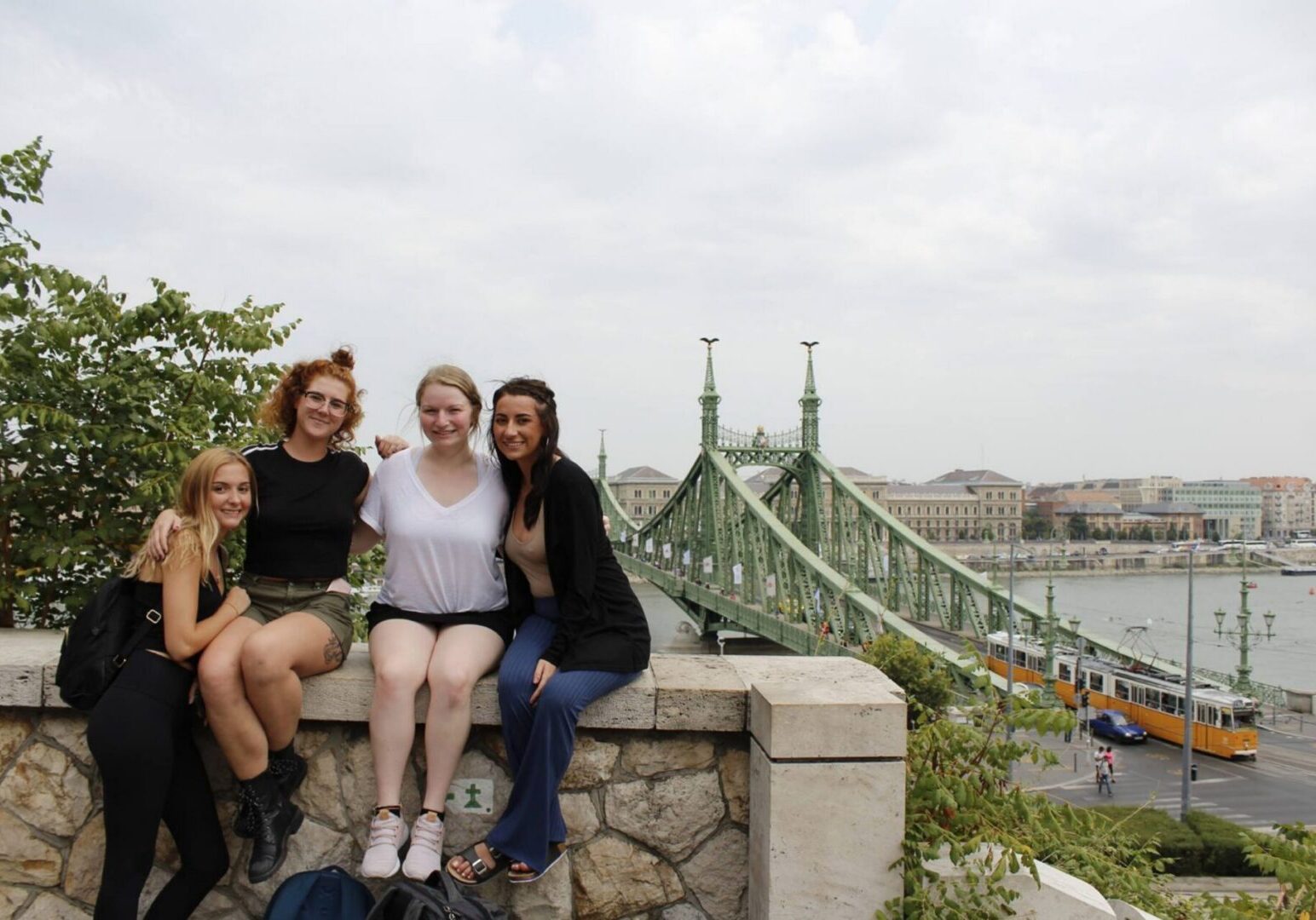Smiling friends with cityscape backdrop