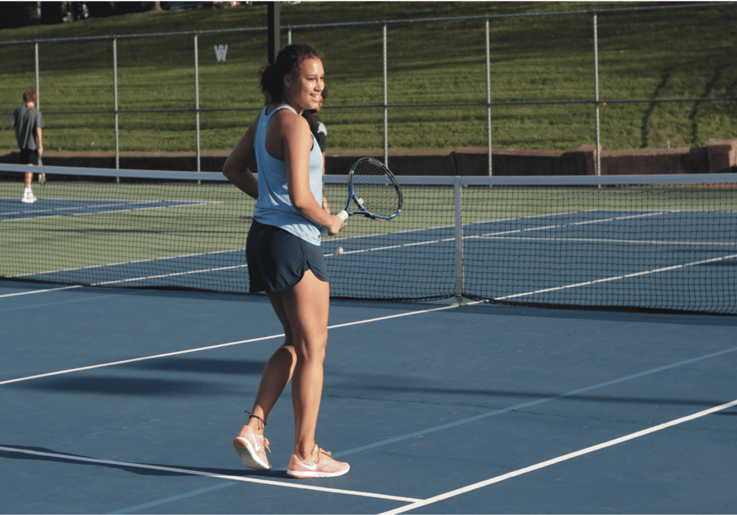 Athlete holding tennis racket on court