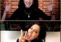 Two women posing with joyful expressions