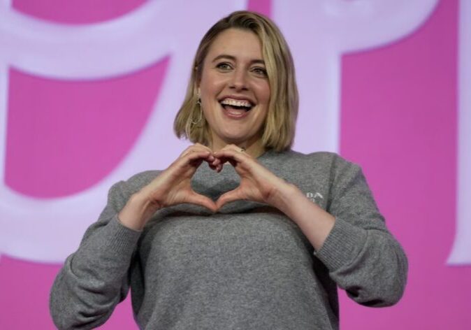 Happy individual forming heart shape
