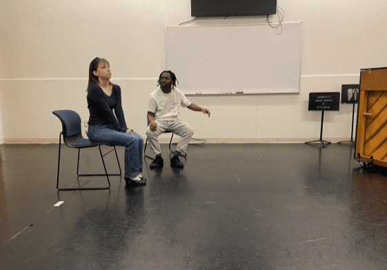 Drama practice with chairs and piano.