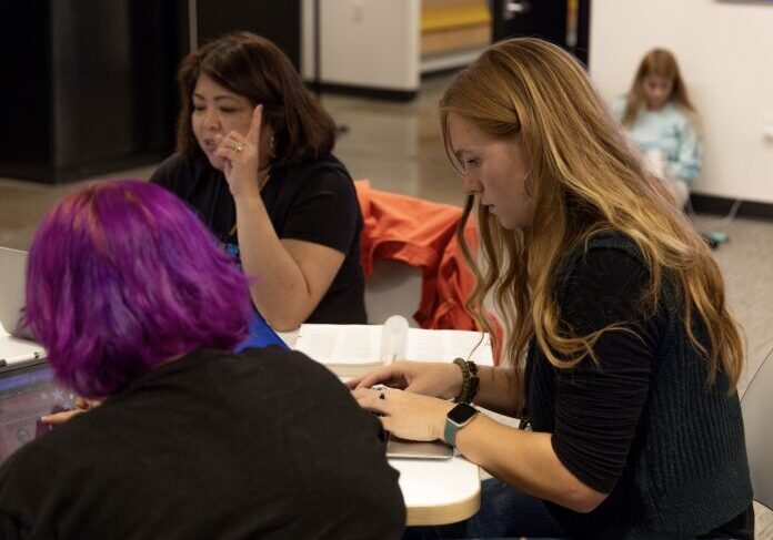 Women working together at a table