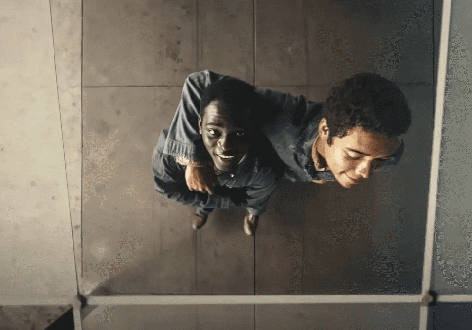 Two friends hugging, seen from above.