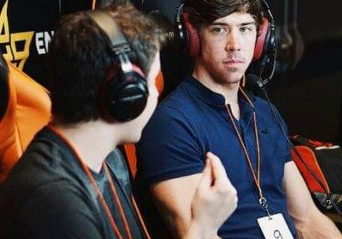 People discussing strategies during gaming event