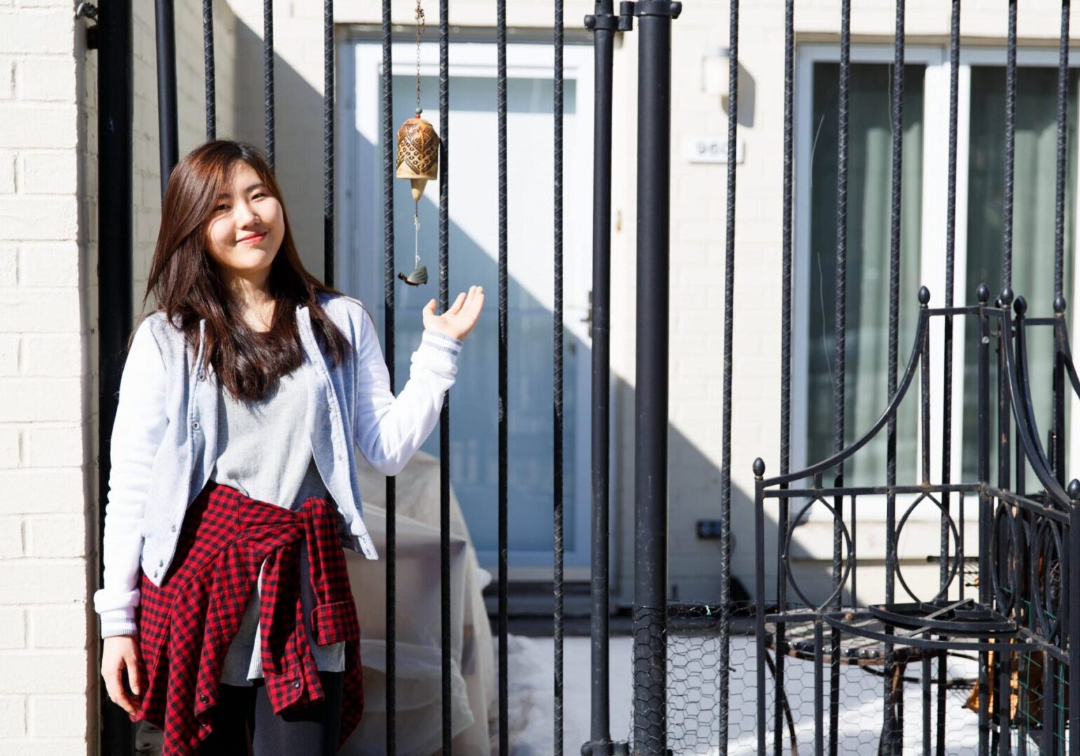 Woman with red plaid shirt outside