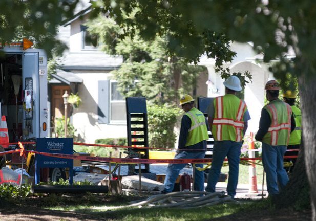 Workers in safety vests at construction site